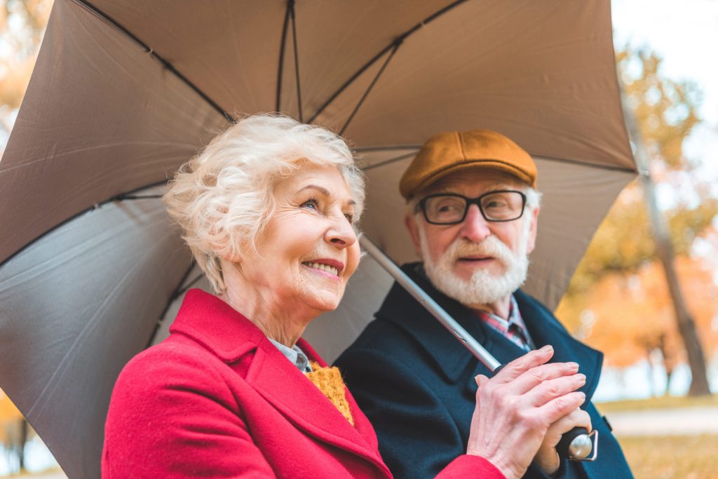 Elderly couple discussing reverse mortgage in Canada